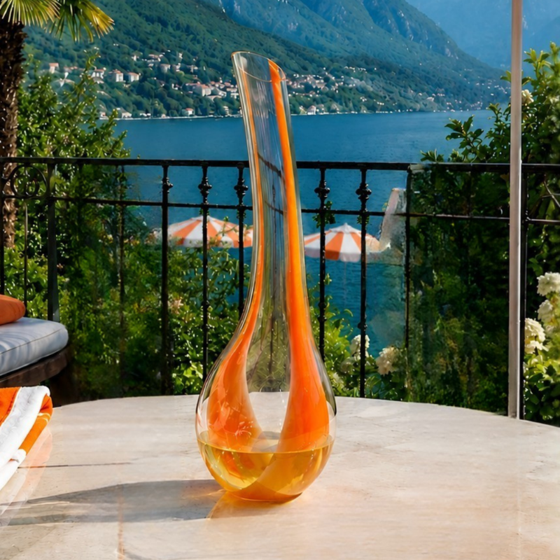 Riedel Cornetto Arancio glass decanter standing upright with orange spiral stripes