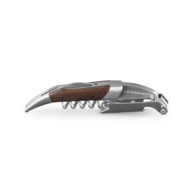 Corkscrew with wooden handle and silver metal accents on a white background