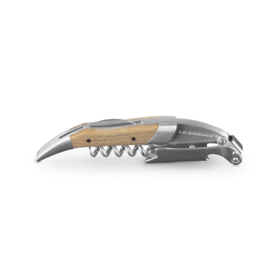 Corkscrew with wooden handle on a white background
